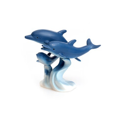 Dolphin family. Figurine isolated on white background