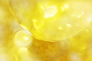 Gold Oil bubbles close up. circles of water macro. abstract shiny yellow background