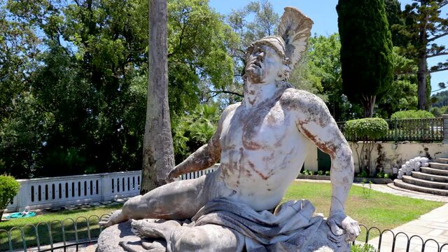 Dying Achilles statue in gardens of Achilleion palace built in Gastouri on Corfu island, Greece for the Empress Elisabeth of Austria - Sisi, 4k video