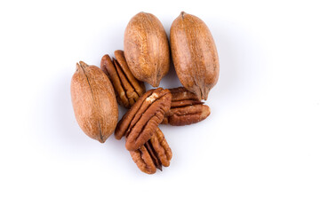 Few pecan nuts isolated on white