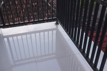 IRON FENCE neatly arranged as a barrier to the roof of the house