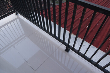 IRON FENCE neatly arranged as a barrier to the roof of the house