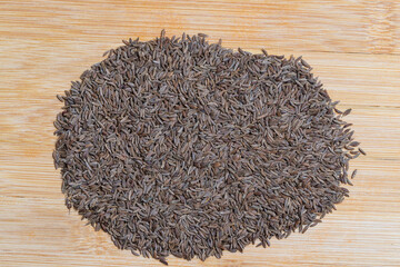 Close up caraway seeds. Dried caraway seeds isolated background. Pile of cumin seeds. Seasoning for food cooking of worldwide kitchen. Flat Lay photo.