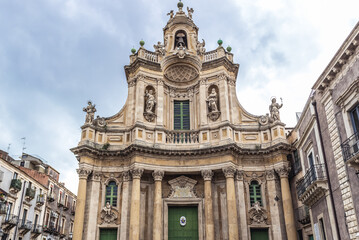 Fototapeta na wymiar Exterior of Basilica della Collegiata church in old part of Catania city, Sicily Island, Greece