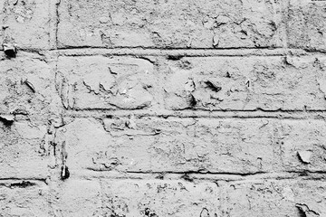 Texture of a brick wall with cracks and scratches which can be used as a background