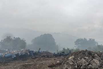 NOVOSIBIRSK, RUSSIA-17 July 2021:Fire at a household waste dump. Environmental pollution. Poisonous...