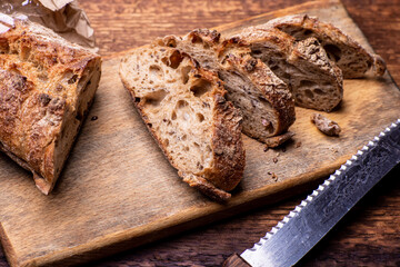Pieces of buckwheat bread. Sliced baguette on a wooden board.