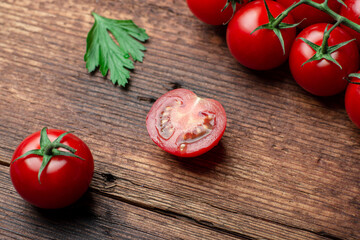 Sliced cherry tops on a wooden background.