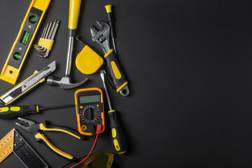 Set of hand tools on a black background. Copy space.