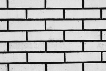 Texture of a brick wall with cracks and scratches which can be used as a background