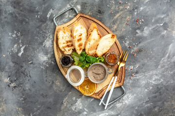 Fototapeta na wymiar Delicious toasted bread with liver pate crostini with red onion jam, Assorted Italian appetizer bruschetta. banner, menu, recipe place for text, top view