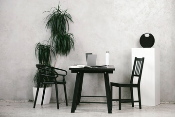 Modern office desk and chair with laptop