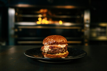 Restaurant meat burger on dark plate and dark background