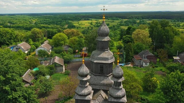 Rural landscape flying around the old wooden church.