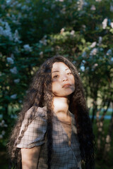 Beautiful asian female standing in front of blossom trees