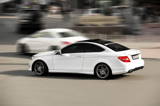 Kiev, Ukraine - May 22, 2021: White Mercedes-Benz C250 Coupe in motion