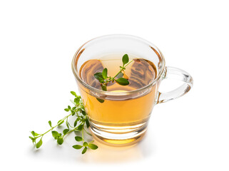 Green tea with lemon balm herb in glass cup isolated on white