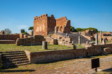 Ostia Antica archaeological site, view of the city forum with the Capitolium surrounded by marble...