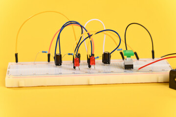 Breadboard with electrical elements, multivibrator circuit.