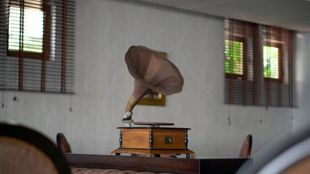 Manavgat-Antalya-Turkey-07.14.2021-An old music devide called gramophone placed in to a bar, on a desk.Music down, lights dim, and no talking.