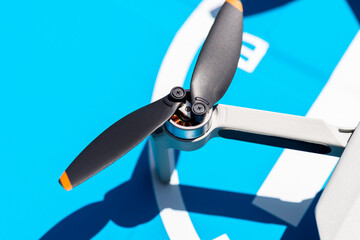 A close-up shot of the complex propellers and brushless motor of a drone against the backdrop of a...