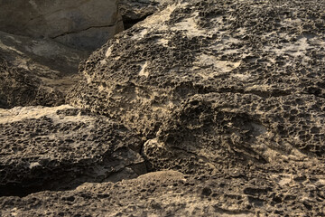 Sunny beige textured sandstone rocks along the French Opal coast along north sea