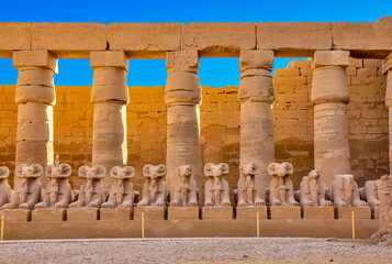 The ram-headed sphinxes in the.so-called Ethiopian court, Karnak, Egypt - obrazy, fototapety, plakaty