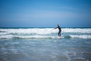 Fototapeta premium the guy on the surfboard caught the wave. Concept: balance, stability, coordination