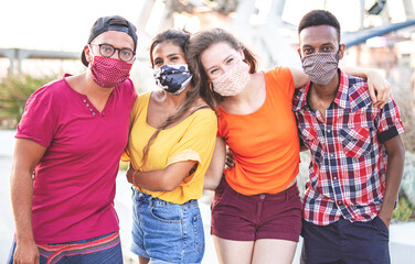 Group of multiracial friends taking photo with face mask on - Young people having fun in holiday -...