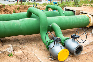 Fototapeta na wymiar New water supply pipes with shut-off valves. City water supply system.