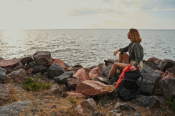 Traveller enjoying a rest at the shore of lake