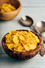 Rustic bowls of cornflakes with spoons