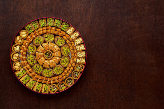 Traditional turkish, arabic sweets baklava assortment with pistachio. Top view, copy space