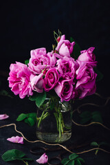 Small pink garden roses in vase