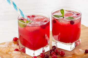 Refreshing drink. Two glasses of cranberry juice or iced cocktail.