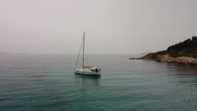aerial shot kalamos island beach and yacht, lefkada, greece