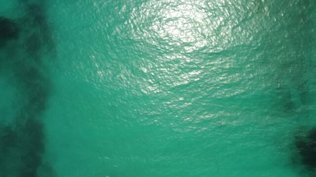 aerial shot kalamos island clear water and yacht, lefkada, greece