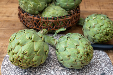 Fresh ripe green artichokes heads ready to cook