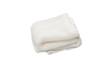 White fluffy cotton towel isolated on a white background.