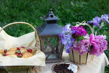 Croissant,strawberries,flowers and coffee,morning breakfast.