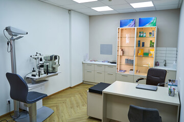 Optician office with work table and optometry equipment
