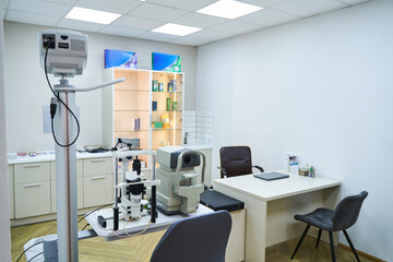 Optician cabinet with optometry equipment and work table