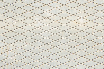 Obraz premium Concrete slab. Drawing of diamonds. The texture of the concrete slab. Gray background.