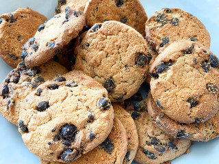Background of oatmeal cookies with chocolate pieces. Oatmeal cookies close-up