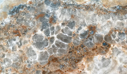 The background is made of marble close-up. Marble texture