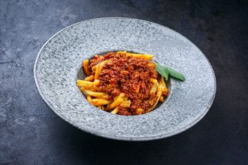 Modern style traditional casarecce al bronzo al rag italian pasta with minced meat tomato ragu...