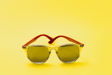 Stylish sunglasses on a yellow background High quality photo Sunglasses.