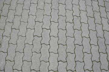 Stone paving slabs lined in rows in full frame