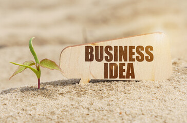 Near the sprout there is a plate with the inscription - BUSINESS IDEA