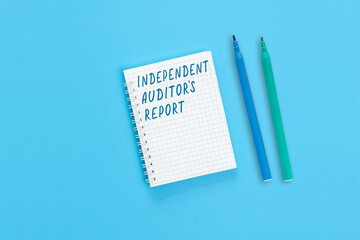 The text Independent report is written on a notebook page